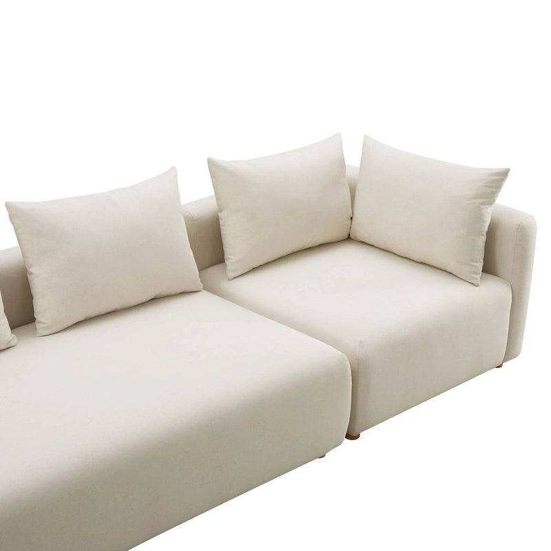 Très long canapé capitonné couleur crème (368 cm)