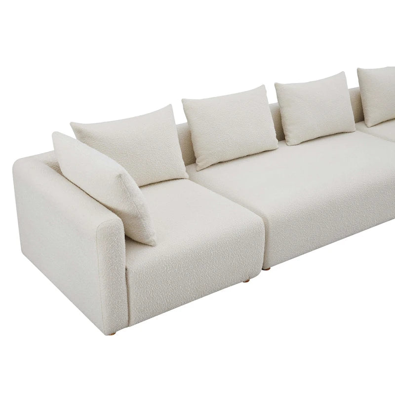 Très long canapé capitonné couleur crème (368 cm)